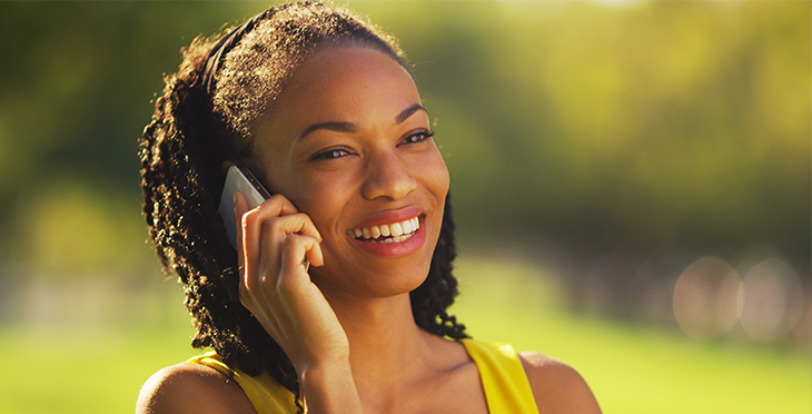 4 Great Ways to Use Voice Broadcasting | Everlytic | Digital communication software | Email marketing | Happy woman on phone | African woman on phone | Black woman on phone | Beautiful woman on phone