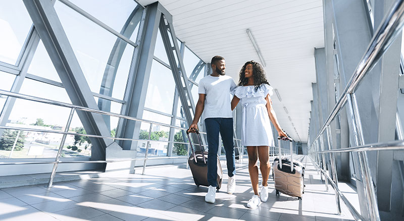 Everlytic | Blog | 5 Email Marketing Tips for the Travel Industry | African Couple at Airport | Travel