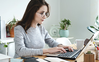 5 Proven Ways to Improve Deliverability on Your Bulk Emails | Everlytic | Email Marketing | Bulk Email | Blog Feature Image | Woman Reading Something off a Laptop